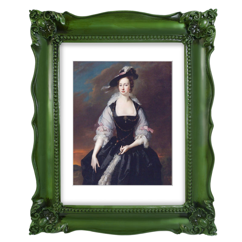 A vintage picture frame with hand-carved floral details in dark green, displayed around a portrait painting.