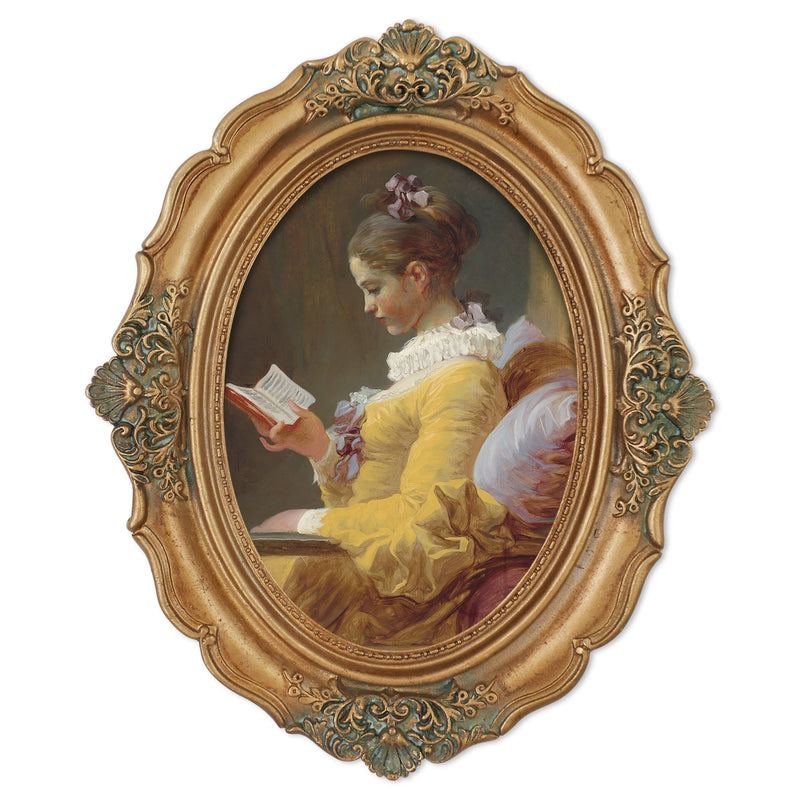 An oval-shaped, gold-colored picture frame with embossed details, containing a framed artwork of a person reading.
