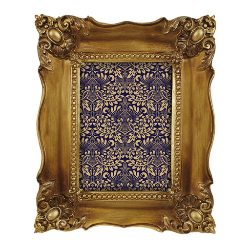 Decorative gold picture frame with intricate patterns on a white background.