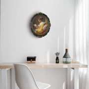 An oval-shaped black picture frame with embossed flourish details. It is designed for both wall and tabletop display.