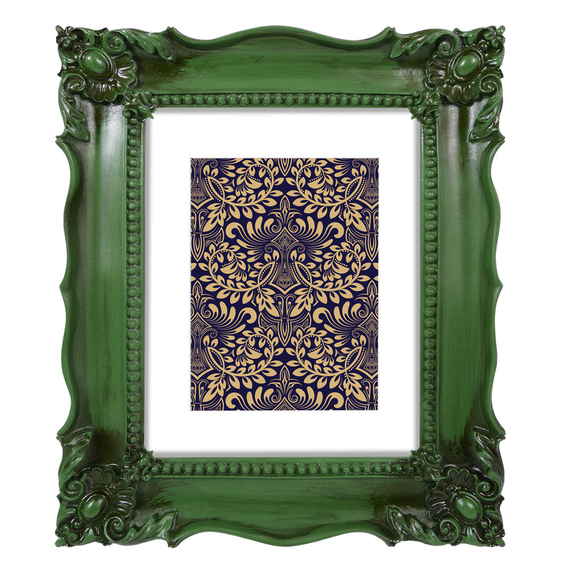 A vintage picture frame with hand-carved floral details in dark green, displayed around a portrait painting.