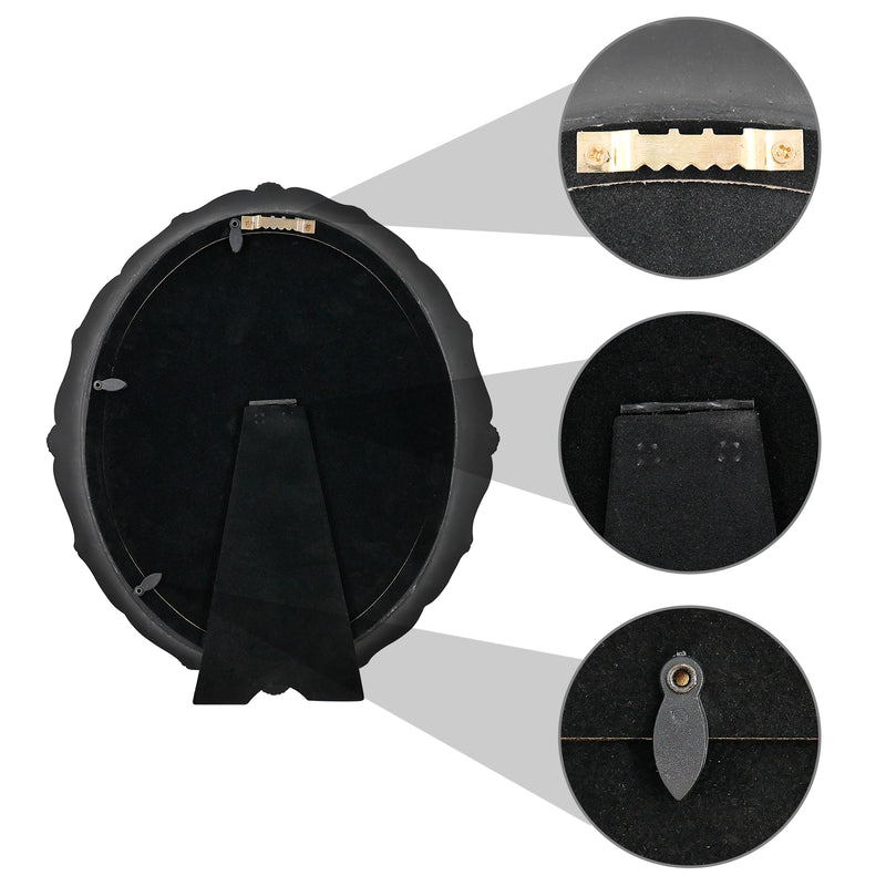 An oval-shaped black picture frame with embossed flourish details. It is designed for both wall and tabletop display.
