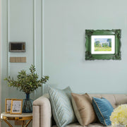 A baroque-style picture frame in dark green color hang on a wall. The frame is designed for wall and tabletop display.