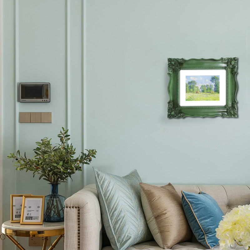 A baroque-style picture frame in dark green color hang on a wall. The frame is designed for wall and tabletop display.