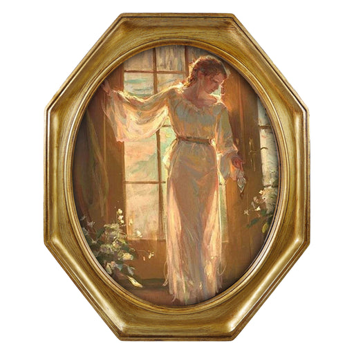 An antique-style octagon picture frame with a brushed gold finish, containing a printed artwork of a woman in a light dress by a window.