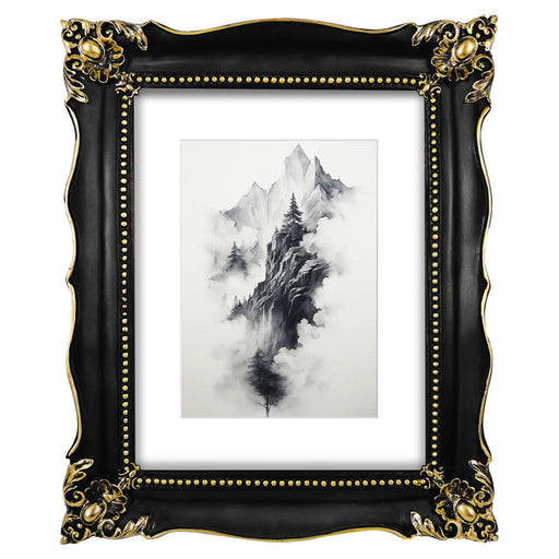 An ornate black picture frame with gold accents, displaying a mountain range artwork.
