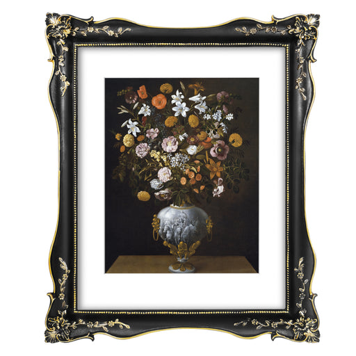 An ornate black picture frame with floral carvings around the border, designed for an 11x14 poster.