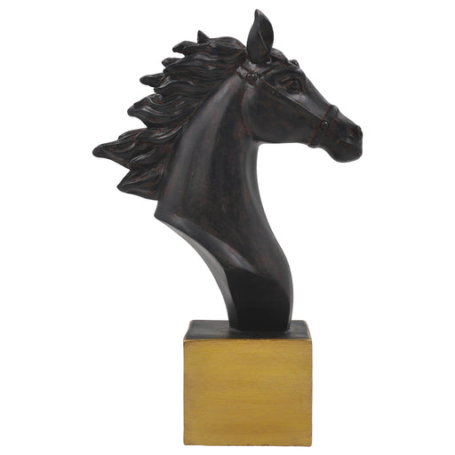 A dark brown horse sculpture standing on a solid golden base.
