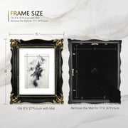 An ornate black picture frame with gold accents, displaying a mountain range artwork.