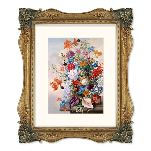Gold picture frames featuring vintage-inspired floral carvings at each corner.