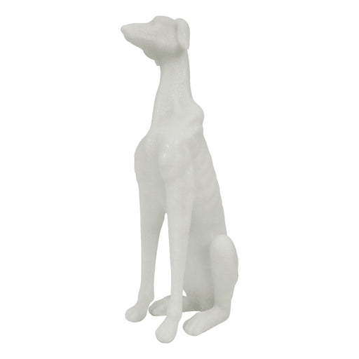 White sparkling dog sculpture on a white background.