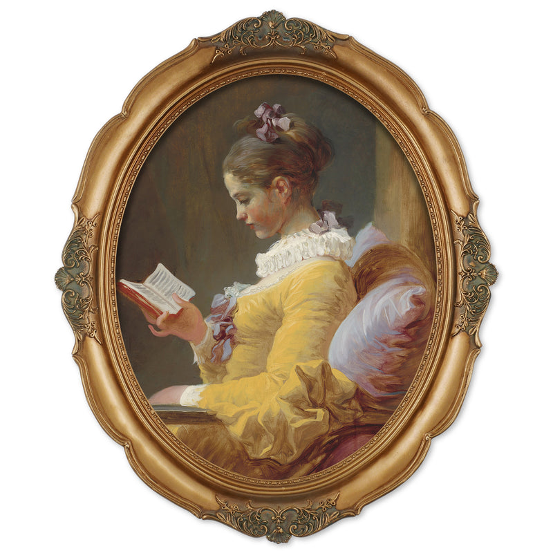 An oval-shaped, gold-colored picture frame with embossed details, containing a framed artwork of a person reading.