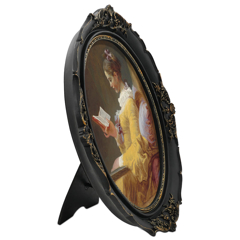 An oval-shaped black picture frame with embossed flourish details. It is designed for both wall and tabletop display.
