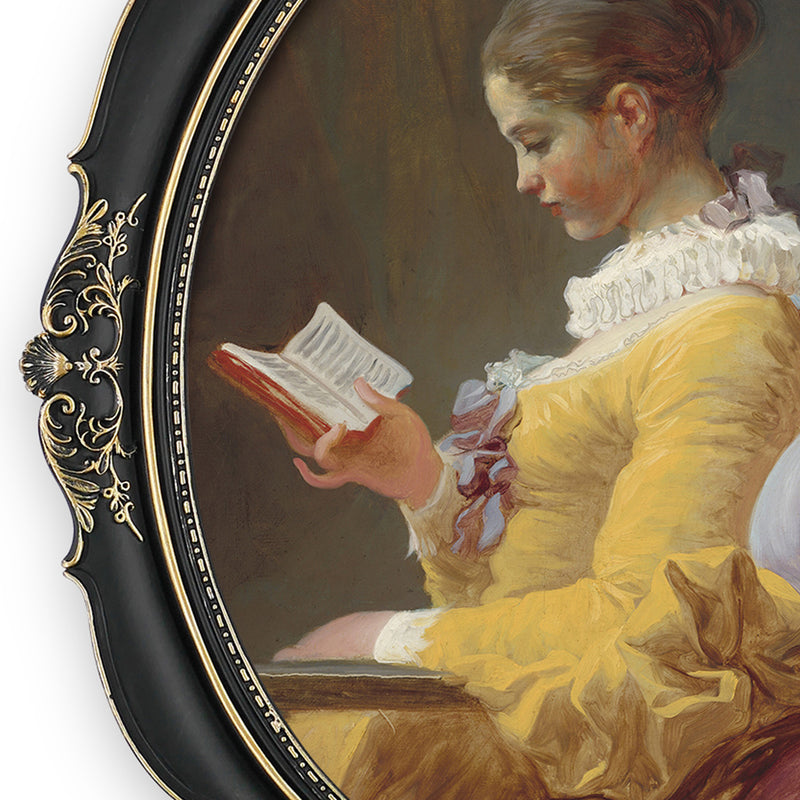 An oval-shaped black picture frame with embossed flourish details. It is designed for both wall and tabletop display.