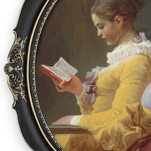 An oval-shaped black picture frame with embossed flourish details. It is designed for both wall and tabletop display.