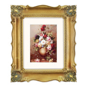 A bronze picture frame with a decorative design, displaying a picture of a floral arrangement inside.