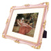 An 11x14-inch picture frame with a mat for an 8x10-inch photo, featuring sculpted edges and decorative accents in a hand-painted antique style finish.