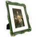 An 11x14-inch picture frame with a mat for an 8x10-inch photo, featuring sculpted edges and decorative accents in a hand-painted antique style finish.