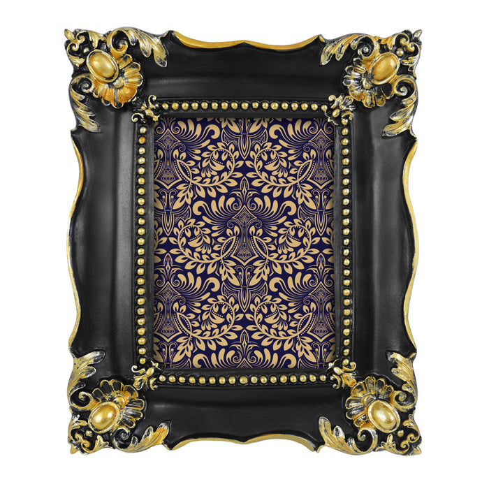 Decorative picture frame with black and gold design.
