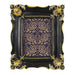 Decorative picture frame with black and gold design.