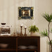 Decorative setup with a coffee machine, candles, and plants on a wooden console table.