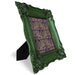 Decorative green frame with intricate design on a white background.