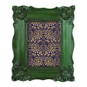 Decorative green frame with a gold and purple patterned interior on a white background.