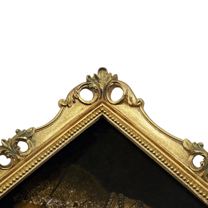 Details of an ornate vintage-inspired gold picture frame, designed for an 8x10-inch picture, featuring a decorative painting of a woman inside.