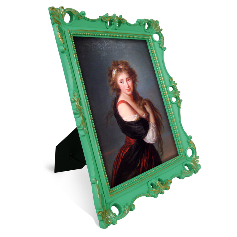 An ornate vintage-inspired picture frame with green edges and gold accents, designed for an 8x10-inch picture, featuring a decorative painting of a woman inside.