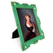 An ornate vintage-inspired picture frame with green edges and gold accents, designed for an 8x10-inch picture, featuring a decorative painting of a woman inside.
