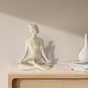 A beige yoga lady statue in a meditation pose, 9.5 inches tall, with a textured surface resembling sandstone.