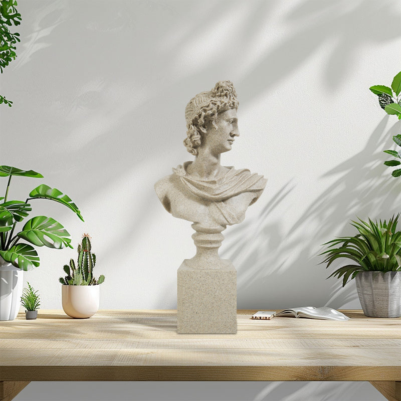 Bust of a classical figure on a wooden table with potted plants.
