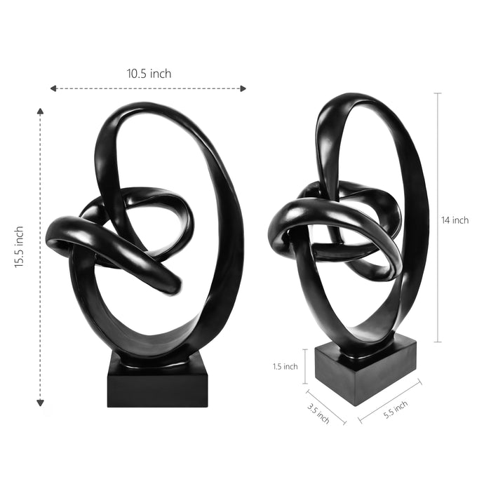 Black abstract sculpture on a white background.