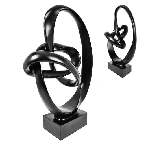 Black abstract sculpture on a white background.