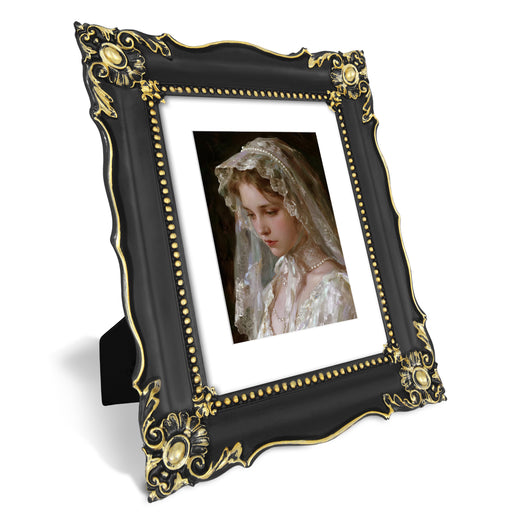 Black 8x10 baroque-style vintage picture frame with mat for 5x7 photos displayed in home décor setting
