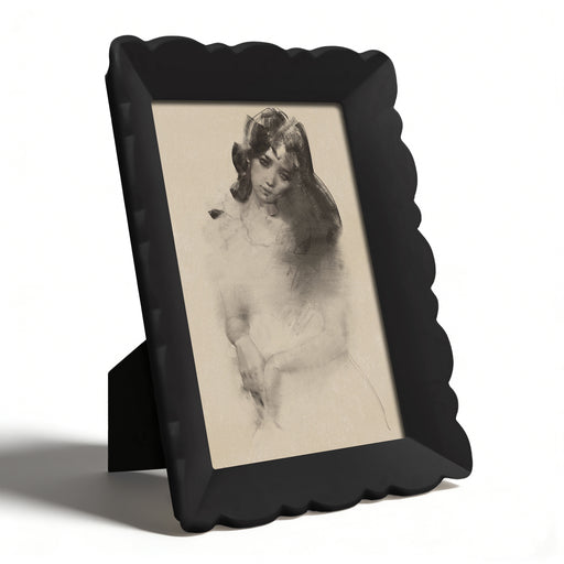 Vintage-style black frame with a nude portrait on a white background