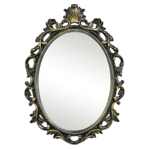 An oval mirror with a scroll design in an antique black with gold finish, reflecting a well-lit interior room.