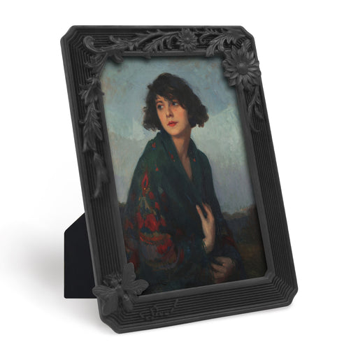 Black vintage 4x6 picture frame with hand-carved butterfly and flower border displayed in home décor setting