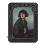 Black vintage 4x6 picture frame with hand-carved butterfly and flower border displayed in home décor setting