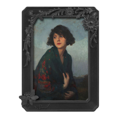 Black vintage 4x6 picture frame with hand-carved butterfly and flower border displayed in home décor setting