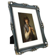 An 11x14-inch picture frame with a mat for an 8x10-inch photo, featuring sculpted edges and decorative accents in a hand-painted antique style finish.
