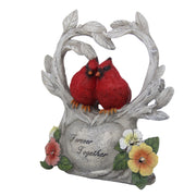 Decorative figurine of two red cardinals on a heart-shaped branch with flowers and 'Forever Together' inscription.