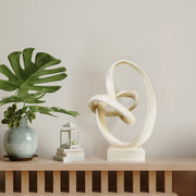 Abstract sculpture with intertwined loops.