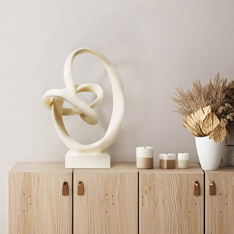 Abstract sculpture with intertwined loops.