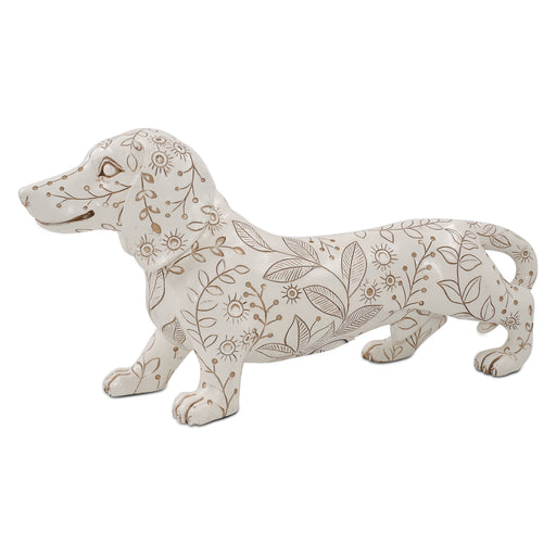 Decorative dog figurine with floral patterns on a white background