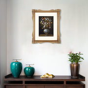 Framed artwork above a wooden console table with decorative items.