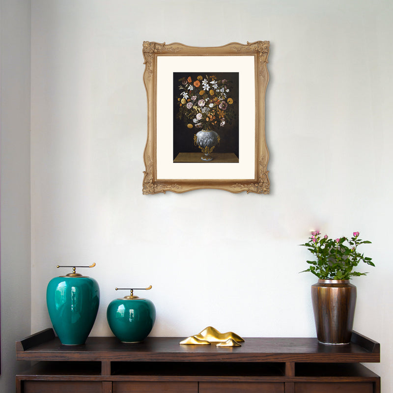 Framed artwork above a wooden console table with decorative items.