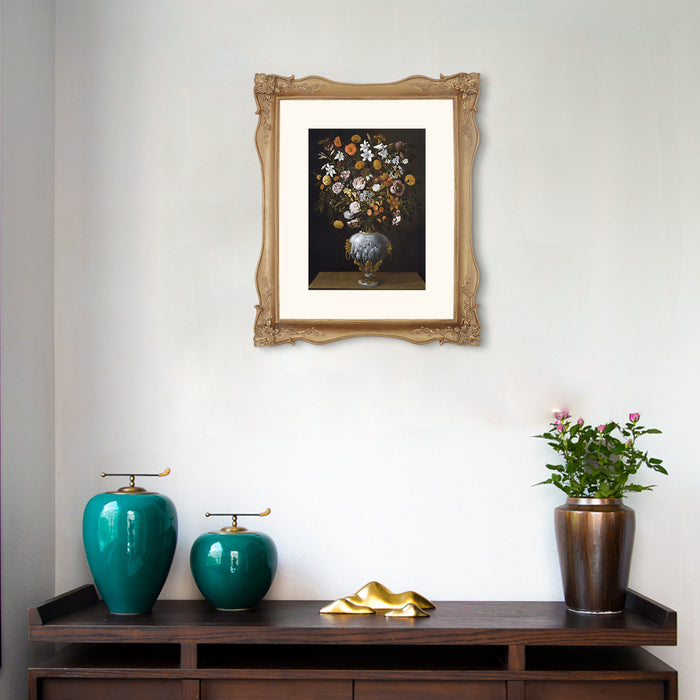 Framed artwork above a wooden console table with decorative items.