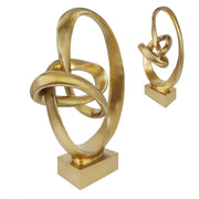 Gold abstract sculpture on a white background