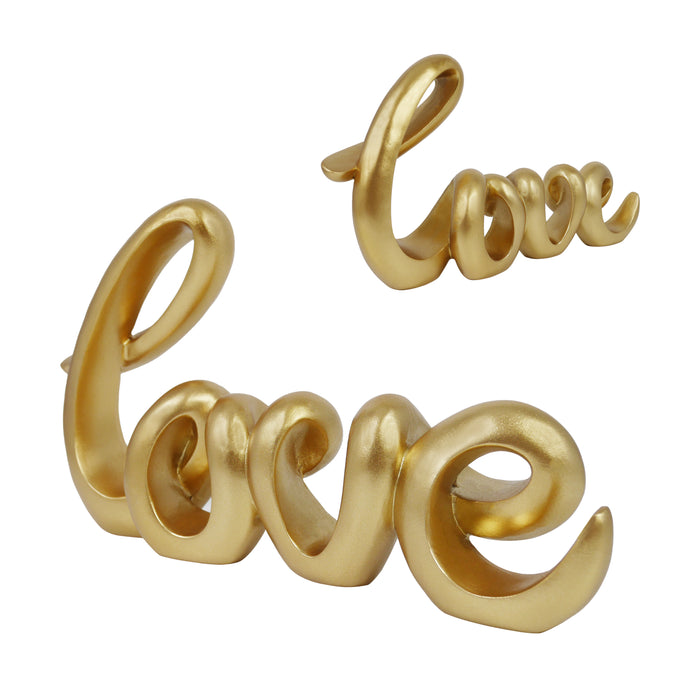 A gold-colored sculpture in the form of the word 'LOVE' in a cursive script, designed for tabletop decor.